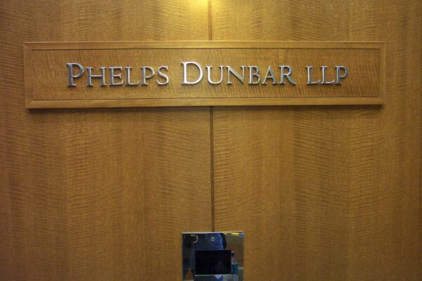 Legal Precision Cut Polished Aluminum Letters on Wood Panel Phelps Dunbar